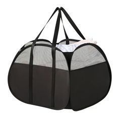 a black and white pet carrier bag with mesh linings on the front, two separate compartments