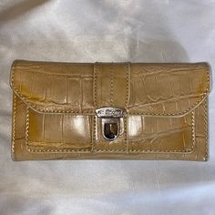 New, Never Used! 7.5” X 4”, Lots Of Storage; 13 Separate Card Pockets, Front Pocket, Zippered Change Storage Purse, Removable Checkbook And Slot For Pen. Snaps Shut With Two Size Options. Beautifully Crafted And Practical. Pet And Smoke Free Home. Classic Tan Bag With Card Slots, Elegant Wallet With Cell Phone Pocket, Vintage Beige Wallets For Daily Use, Classic Beige Clutch Wallet, Elegant Wallets With Snap Closure, Elegant Everyday Tan Wallet, Beige Envelope Wallet For Everyday Use, Beige Leather Clutch With Card Slots, Rectangular Wallets With Snap Closure For Daily Use