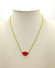 The LOLI' necklace is nice, cheerful and evocative, unalterable golden steel chain, cm. 40, and mouth in red enamel with small zircon cm. 1.8. Trendy Enamel Necklace With Adjustable Chain, Red Chain Charm Necklace For Gift, Gold Enamel Necklace For Party, Gold Enamel Party Necklace, Trendy Red Adjustable Chain Necklace, Trendy Red Charm Necklace With Clavicle Chain, Enamel Chain Necklace For Gift, Red Metal Charm Necklace With Adjustable Chain, Trendy Red Charm Necklaces For Gifts