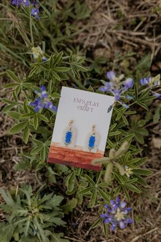 Dainty Bluebonnet Dangles! A neutral background with a beautiful hand-painted Bluebonnet.  Em's Clay & Craft earrings are made out of Polymer Clay. The earrings have a gold-plated surgical stainless steel ball post and jump rings. All jewelry components are Hypoallergenic. Most of my earrings come in a reusable Muslin logo bag. Bigger statement earrings and hoop earrings will come in a jewelry box.  Each pair of my earrings is slow-made and handmade! Slight variations between shape and coloring may occur, this is normal as each piece is unique in its making.  If you need more photos or are interested in custom orders, please reach out to me! https://www.etsy.com/shop/EmsClayandCraft Blue Teardrop Jewelry For Spring, Texas State Flower, Craft Earrings, Texas Jewelry, Big Statement Earrings, Earring Jewelry Box, Large Statement Earrings, Texas Gifts, Neutral Background