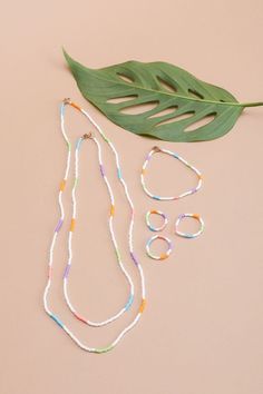 We love our single strand handbeaded necklaces so much that we decided to add a new length! Say hello to Quinn! This necklace is meant for layering, put Quinn with your gold chains, mix her up with another beaded necklace or just wear her solo. Now available in white stripe, vibrant white strand with pops of mint, bubblegum pink, soft purple, and electric blue. - single strand handbeaded multi colored necklace - gold filled lobster claw closure - handmade in Mexico - 23” fixed length White Beaded Necklaces For Layering, Everyday Heishi Beads Jewelry, Everyday Multi-strand Beaded Jewelry, Everyday White Single Strand Beaded Necklace, Minimalist White Beaded Necklaces For Everyday, White Beaded Chain Dainty Jewelry, White Handmade Beads, White Beaded Chain Necklace For Everyday, Minimalist White Beaded Necklace For Everyday