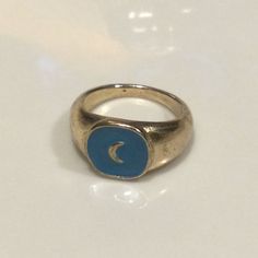 Brand New Boutique Item! Beautiful Crescent Moon Signet Ring. Sky Blue Enamel Coated Face With Embossing, Stainless Steel Band With Antique Silver Finish. A Little Shy Of 0.5” High. Size 7.5. All Of The Jewelry In My Closet Is Nickel Free! Tags Free People Anthropologie Zara Madewell J. Crew Urban Outfitters Modcloth Lucky Brand Dolls Kill Verameat Boho Gypsy Witchy Tarot Celestial Crystal Moon Pagan Mystic Blue Enamel Ring, Celestial Style Metal Ring Jewelry, Celestial Metal Ring Jewelry, Handmade Celestial Blue Rings, Handmade Blue Celestial Rings, Handmade Blue Metal Rings, Nickel Free Blue Metal Rings, Celestial Style Blue Ring As A Gift, Blue Metal Ring As Gift