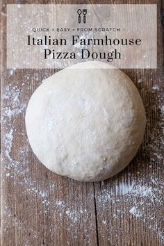 a round pizza dough sitting on top of a wooden table