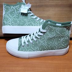 Green High Top Sneakers 100% Cotton Size 8.5 New With Tags Casual Custom Sneakers With Gum Sole For Spring, Green Casual High-top Sneakers For Spring, Casual Green High-top Sneakers For Spring, Casual Green Custom Sneakers With Speckled Midsole, Casual Green Canvas Shoes With Speckled Midsole, Casual Custom Sneakers With Round Toe, Casual Green Mid-top Canvas Shoes, Casual Green High-top Custom Sneakers, Casual Mid-top Skate Shoes For Spring