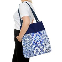 Embrace the essence of Portugal with this stunning blue tile-inspired bag. 🇵🇹 Elevate your style with a touch of tradition and a pop of color. 💙 #PortugueseChic #BlueTileVibes #FashionInspiration Tote is made from 100% Polyester with two handles for carrying. Large Tote measures 18 x 18 inches. Machine washable however, we recommend hand wash/spot cleaning only for best lasting results. .: 100% Polyester .: Boxed corners .: Black cotton handles .: Black lining ♡ Additional information ♡ When Blue Large Capacity Canvas Bag Gift, Blue Canvas Bag With Large Capacity As Gift, Blue Large Capacity Canvas Bag As Gift, Blue Canvas Shoulder Bag Gift, Blue Large Capacity Canvas Bag For Gift, Blue Large Capacity Shoulder Bag Gift, Blue Large Capacity Shoulder Bag As Gift, Blue Canvas Shoulder Bag For Gift, Blue Shoulder Bag With Large Capacity As Gift