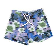 This is a pair of vintage floral motion blur swim trunks, they are in deadstock condition and labeled as a size 30 waist. Blue Athletic Shorts With Built-in Shorts For Summer, Fitted Surfing Shorts For Summer, Fitted Shorts For Surfing In Summer, Spring Poolside Athletic Shorts, Multicolor Hawaiian Style Shorts, Green Hawaiian Style Short Bottoms, Spring Poolside Short Length Swim Trunks, Spring Surfing Swim Trunks, Short Length Floral Print Swimwear For Beach Season