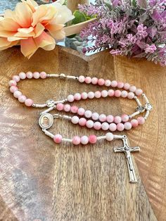 Connect with your faith through this exquisite Handmade Rosary from Medjugorje, featuring a beautiful blend of white and light pink pearl ceramic beads. The soft and calming hues of the beads symbolize serenity and devotion, making this rosary not only a powerful tool for prayer but also a stunning keepsake. The rosary is centered around a unique "3x Peace" (3x Mir) Steel Cross, which represents the profound message of peace associated with Medjugorje. Crafted from durable stainless steel, the c Pink Beaded Spiritual Rosary, Pearl Ceramic, Our Lady Of Medjugorje, Handmade Rosary, Steel Cross, Summer 24, Prayer Cards, Pink Beads, Ceramic Beads