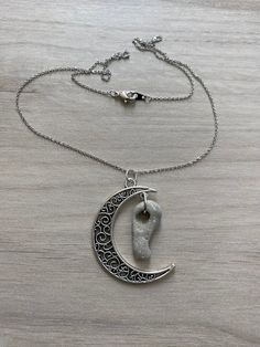 Hag Stone Necklace, Holey Stone Pendant, Crescent Moon Necklace, Celestial Jewelry, Odin Stone, Faerie Stone, Pagan Stone, Witch Stone The necklace pictured is the one you will receive. 17 1/2" holey stone necklace on a 16K gold-plated over brass chain with silver finish. Silver-plated half moon pendant. BACK TO MY SHOP: https://www.etsy.com/shop/SeaByTheShore Use coupon code FREESHIP50 to receive free shipping on all orders over $50.00. Celestial Moon-shaped Jewelry For Meditation, Celestial Moon Jewelry For Meditation, Celestial Crescent Jewelry For Meditation, Adjustable Moon Shape Necklace With Moon Charm, Silver Half Moon Necklaces For Jewelry Making, Silver Half Moon Necklace For Jewelry Making, Spiritual Crescent Wire Wrapped Necklaces, Adjustable Crescent Symbolic Jewelry, Spiritual Crescent Crystal Necklace With Moon Charm