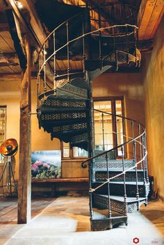 a spiral staircase in the middle of a room