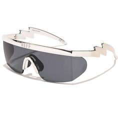 These Neff sunglasses exude a blend of futuristic style and practicality. Crafted with precision, these sunglasses feature a sleek silver lightning design that seamlessly merges modern aesthetics with functionality. The wraparound frame offers ample coverage, ensuring protection from all angles against harsh sunlight. The lenses, equipped with UV protection, shield the eyes from harmful rays, making them ideal for sunny days and outdoor adventures. The oversized shape enhances the wearer's style Futuristic Sunglasses For Summer Outdoor, Trendy Silver Aviator Sunglasses With Uva Protection, Modern Silver Sunglasses For Outdoor, Summer Silver Shield Sunglasses With Anti-reflective Coating, Futuristic Sunglasses With Mirrored Lenses For Streetwear, Futuristic Mirrored Sunglasses For Streetwear, Modern White Sunglasses For Streetwear, Modern Silver Aviator Sunglasses With Uv Protection, Futuristic Polarized Sunglasses For Outdoor Use