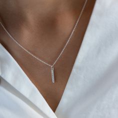 A petite version of our best selling Mini Bar Necklace. Add a little sparkle with our diamond dusted option or up the ante with a diamond set in the pendant. We love adding a mini bar and petite bar pendants to one chain for an extra personal touch. details+ petite bar pendant measures 5/8" long+ add a brilliant 1.5mm diamond option+ on model : 16 & 18" adjustable necklace+ s hook closure+ handmade with love in our Georgia studio availability handmade to order. ships in 5 - 14 days.current produ Dainty Sterling Silver Bar Necklace For Everyday, Everyday Minimalist Sterling Silver Birthstone Necklace, Silver Dainty Bar Necklace For Everyday, Minimalist Silver Birthstone Necklace For Everyday, Everyday Minimalist Silver Birthstone Necklace, Minimalist Sterling Silver Bar Necklace For Anniversary, Minimalist Silver Bar Necklace For Anniversary, Bar Pendants, Promise Necklace