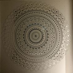 an intricately designed wall hanging in a room