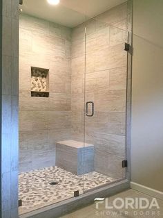 a walk in shower sitting inside of a bathroom