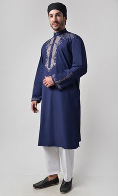 Fabric is 100% cotton Poplin Front button down Mandarin collar Front yoke and sleeves embroidered Length is 42-44" Side Pockets Machine wash cold with like colors and tumble dry Traditional Blue Kurta With Embroidered Sleeves, Traditional Long Sleeve Kurta With Embroidered Cuffs, Festive Cotton Traditional Wear With Embroidered Sleeves, Embroidered Long Sleeve Winter Kurta, Winter Embroidered Long Sleeve Kurta, Traditional Long Sleeve Kurta With Tonal Embroidery, Cotton Kurta With Embroidered Sleeves For Eid, Long Sleeve Kurta With Chikankari Embroidery, Casual Cotton Traditional Wear For Festive Season