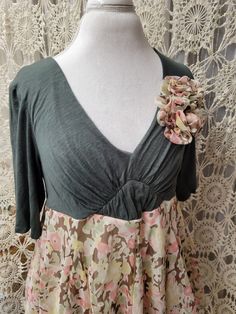 Green top, empire style, deep V-neck, sewn on flowers. Lined skirt bottom. Size... L Bust... 40" stretches. Waist... 44" Shoulder to fabric change... 13" Shoulder to hem... 26"  All my items are re-created by adding a skirt, scarf, fabric or lace to a vest or blouse, for a one-of-a-kind look.  Everything is pre-washed and suggested that hand washing, or gentle machine wash recommended.  Do not use an iron or dryer heat on items with appliques. Cotton Patchwork V-neck Blouse, Cotton V-neck Patchwork Blouse, V-neck Cotton Blouse With Patchwork, Cotton V-neck Blouse With Patchwork, Stretch Floral Print V-neck Blouse, Spring V-neck Patchwork Blouse, Spring V-neck Patchwork Tops, Spring Patchwork V-neck Tops, Fitted Patchwork V-neck Top