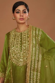 Olive green silk anarkali with gota, sequins and pearls hand embroidery. Comes with salwar and an organza dupatta. - Aza Fashions Green Kundan Sharara For Eid, Semi-stitched Green Salwar Kameez With Dori Work, Bollywood Style Green Sharara With Mirror Work, Green Dola Silk Sharara With Mirror Work, Designer Kundan Palazzo Set For Festivals, Green Dola Silk Palazzo Set With Mirror Work, Gold Churidar With Mirror Work And Straight Kurta, Bollywood Style Silk Kurta With Zari Work, Designer Bollywood Silk Churidar