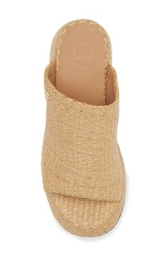 Woven raffia adds a boho-cool aesthetic to a slide sandal lofted by a chunky platform and sculptural block heel. 3 1/4" heel (size 39) Synthetic and textile upper and lining/synthetic sole Made in Portugal This brand has B Corp certification, representing business practices with emphasis on social and environmental performance, accountability and transparency
 This brand meets Nordstrom Responsible Brands criteria: brand adheres to responsible social and environmental practices Chic Natural Color Synthetic Heels, Vacation Wedge Sandals With Wooden Heel, Spring Natural Wedge Sandals With Block Heel, Beach Wedge Heels With Wooden Heel, Chic Natural Sandals With Wrapped Heel, Spring Natural Color Wedge Sandals With Block Heel, Beach Heels With Wooden Wedge Heel, Wedge Heels With Wooden Heel For Beach, Vacation Wooden Heel Wedge Sandals