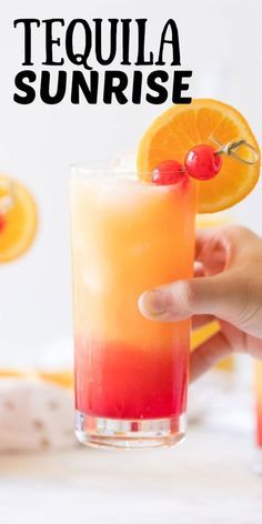 the tequila sunrise cocktail is garnished with oranges and cherries