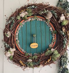 a wreath is hanging on the front door