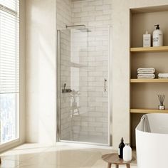 a bathroom with a tub, shower and shelves