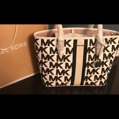 Michael Kors Jet Set Tote Bag 10.5h X 15.75w X 4.75d Handle Drop 9.5’ 100%Nauthentic 100% Polyester Lining Tote Bag Coated Canvas 90% Canvas 10% Polyester Gold Tone Hardware Clip Fastening Crafted From Durable Canvas That’s Detailed With Bold Stripes , Spacious Interior To Store All Your Personal Items.... Wallet, Phone,Tablet, Makeup Bag Etc.... Brand New And Still Inside Shopping Bag Mk Tote Bag, Michael Kors Bedford, Bags Michael Kors, Large Leather Tote, Black Leather Tote, Leather Handbags Tote, Bold Stripes, Small Tote, Purses Michael Kors