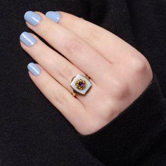 A unique ring featuring an amethyst cabochon atop a white agate backdrop. We created this unique 10k gold ring by riveting the top of an antique shirt stud (circa 1910) onto a 1920s era signet ring. The face of the ring measures 0.7 inches by 0.55 wide, and it is in good condition with some light crazing to the onyx (visible only under magnification). The ring is a size 6.25, but it can be resized free of charge. Materials: 10k gold, Agate, Amethyst. Vintage Yellow Gold Enamel Ring With Gemstone, Vintage Enamel Jewelry With Gemstone, Vintage Enamel Gemstone Jewelry, Vintage White Jewelry With Bezel Setting, Vintage White Rings With Bezel Setting, White Vintage Rings With Bezel Setting, White Enamel Ring For Formal Occasions, Formal White Enamel Gemstone Ring, Vintage White Birthstone Jewelry