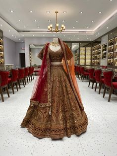 Feel like royalty on your special day with our Burgundy Gold Bridal Lehenga. The rich burgundy color is complemented by intricate gold bead work on the velvet blouse. The velvet border adds a touch of elegance to this beautiful lehenga. Stand out and make a statement with this luxurious piece. Fabric: Net with Raw Silk lining! WASH CARE INSTRUCTIONS - Please Dry clean only when it is applicable! Ready to Ship! Gold Bridal Lehenga, Beautiful Lehenga, Gold Lehenga, Zari Embroidery, Velvet Blouse, Long Dress Design, Desi Clothes, Velvet Blouses, Braided Hairstyles For Wedding