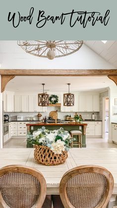 an open kitchen and dining room with wood beams on the ceiling, white cabinets and wooden chairs