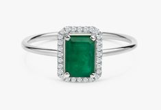 "14k Gold Emerald and Diamond Ring / Solid Gold Diamond Ring / Emerald Engagement Ring / Halo Rectangular Setting / Dainty Emerald Ring ✔ Handmade ✔ Setting Size: 9.5 x 7.5 mm ✔ Diamond Ct Weight: 0.09ctw ✔ Emerald Ct Weight: 1.15 All our emeralds are treated natural emeralds (Emeralds are typically treated with oil or other \"fillers\" to draw the filling substance into any surface-reaching fissures to improve the clarity of the emerald) ✔ Band Thickness: 1.2mm ✔ Solid Gold ✔ Natural Diamonds a Green Radiant Cut Diamond Ring Gift, Green Radiant Cut Diamond Ring As Gift, Formal Green Rectangular Diamond Ring, Green Emerald Cut Birthstone Ring With Halo Setting, Green Radiant Cut Diamond Ring With Gemstone, Emerald Cut Green Birthstone Ring With Halo Setting, Emerald Cut Green Gemstone Cluster Ring, Green Emerald Cut Gemstone Cluster Ring, Green Cluster Ring With Halo Design