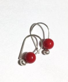 Petite and sweet blush berry red Coral gemstone earrings...modern design, minimal in mind... = details =  6mm red Coral suspend from... 3mm fine silver budded ear wires.  approx. 3/4"  long finish options: bright silver or lightly oxidized patina  Note: To put on, gently pull wires side ways in opposite directions and slide through ear hole in order to keep their shape. Each handmade ArtAffections Jewelry piece is presented to you hanging on a card within a plastic sleeve and ready wrap up as a gift. BEAD STONE EARRINGS GALLERY: https://www.etsy.com/shop/ArtAffectionsJewelry?ref=seller-platform-mcnav&search_query=BEAD+EARRINGS RETURN TO SHOP : ArtAffectionsJewelry.etsy.com FEEDBACK: "One of Etsy's best! This seller is phenomenal...worked with me on a special order & was very accommodating Minimalist Red Round Earrings, Nickel-free Red Earrings For Everyday, Red Nickel-free Earrings For Everyday Wear, Dainty Red Earrings For Everyday, Red Sterling Silver Earrings For Everyday, Red Hypoallergenic Dainty Earrings, Red Hypoallergenic Earrings For Everyday Wear, Small Hoop Red Earrings For Everyday, Dainty Handmade Red Earrings