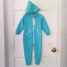 Small Fleece Lined Jumpsuit With Front Pockets And Hood. 30 Inches Long. 12.5 Inch Inseam. About 11 Inch Sleeves. Blue Fleece Tracksuit For Loungewear, Blue Cotton Tracksuit For Jogging, Blue Cotton Hooded Tracksuit, Blue Hooded Cotton Tracksuit, Fitted Blue Tracksuit For Loungewear, Casual Stretch Onesie For Playwear, Blue Hooded Onesie For Winter, Blue Fleece Hooded Tracksuit, Stretch Blue Tracksuit For Winter