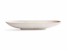 a white bowl sitting on top of a table