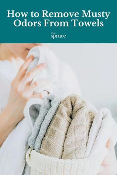 a woman holding towels in her hands with the title how to remove musty odors from towels