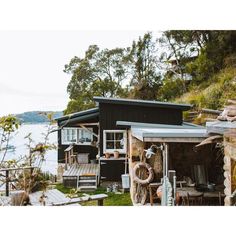 an image of a boat house on the water