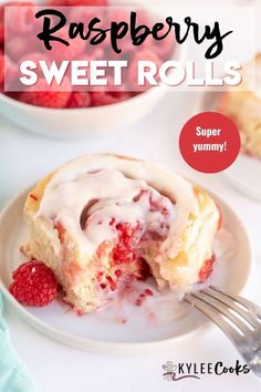 raspberry sweet rolls on a plate with a fork