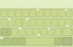 the keyboard is green with white cats on it