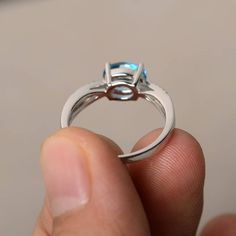 This is a gorgeous handmade creation. Its beauty is its simplicity & Elegance. The 6*8 mm oval shape faceted real Swiss Blue Topaz is crafted in solid sterling silver and with rhodium plated. Main stone weight about 1.47 ct. CZ as accents. All item is sent in a beautiful gift box If you have any idea of design your ring,pls contact me directly. You can realize more lovely stuff clicking the link https://www.etsy.com/shop/knightjewelry?refshopsection_shophome_leftnav Please leave the correct Modern Oval Blue Topaz Ring, Oval Topaz And Diamond Proposal Ring, Oval White Gold Topaz Birthstone Ring, Modern Oval Topaz Birthstone Ring, Modern Blue Topaz Oval Ring, Modern Oval Topaz Ring With Prong Setting, Blue Topaz Ring For Proposal, Oval Topaz Birthstone Ring In Sterling Silver, Oval Blue Topaz Ring For Anniversary