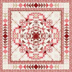 a red and white quilt with an intricate design