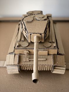 a cardboard model of a tank on the ground