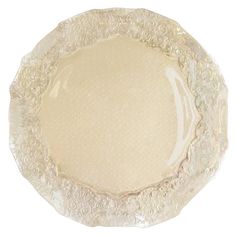 a white plate with lacy doily on the edge and an empty plate in the middle