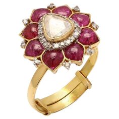 This exquisite ring is handcrafted in 18-karat gold. It is set in .80 carats ruby and .52 carats of sparkling diamonds. FOLLOW MEGHNA JEWELS storefront to view the latest collection & exclusive pieces. Meghna Jewels is proudly rated as a Top Seller on 1stDibs with 5-star customer reviews. All items manufactured by us are handmade and can be customized or redesigned. Certificate available upon request. Composition Gross Weight: 3.86 Grams Gold Net Weight: 3.57 Grams Ruby .80 carats Diamond Weight