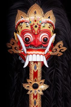 an elaborate mask is displayed on a black background