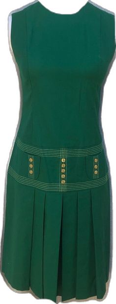 Green Casual Dress With Pleated Skirt, Cotton Mini Dress With Pleated Waist, Casual Green Dresses With Pleated Skirt, Green Pleated Knee-length Mini Dress, Green Knee-length Mini Dress With Pockets, Cotton Pleated Mini Dress, Cotton Mini Dress With Pleated Skirt, Sleeveless Cotton Dress With Pleated Hem, Green A-line Dress With Pleated Skirt