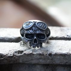 Article name : REBELLION RING Environmentally friendly metal made with passion and great attention to detail 🔨 Very comfortable to wear daily and in any occasion 🖤💍 Shipped from Jakarta, Indonesia Standard shipping use USPS ( US Customers ) Singapore post ( Rest of the world ) Express shipping use DHL Express Note : Please put a phone number in a note for DHL Express, it needs to require. Office number or any number will be fine. Thank you for stoping by in my gallery. Really appreciate it. D Black Biker Skull Ring Gift, Silver Skull Ring For Biker Events And Halloween, Black Biker Style Skull Ring As Gift, Symbolic Metal Skull Ring For Collectors, Vintage Handmade Skull Ring, Vintage Skull Metal Rings, Handmade Metal Skull Ring Collectible, Silver Skull Ring Collectible, Adjustable Silver Skull Ring Collectible