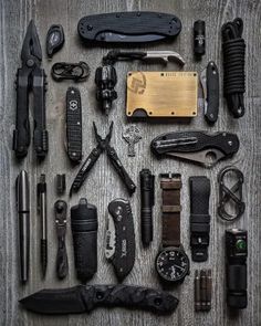 many different types of knifes and knives laid out on a table