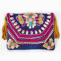 The bohemian design features intricate embroidery and delicate beading with a trim of tassels. This bag is decorated with shells and beads perfect for any occasion. It is also called banjara bags, wear it with a casual or formal dress this bag looks elegant and classy with any outfit you wear. It comes with a leather belt that looks great with this banjara bag. It comes with a cotton lining inside the bag with one zipper pouch. You can put your daily essentials like mobile, keys, notebook, etc. Bohemian Pouch Bags For Vacation, Bohemian Straw Bag With Tassels For Daily Use, Bohemian Shoulder Beach Bag With Tassels, Bohemian Beach Shoulder Bag With Tassels, Bohemian Handwoven Beach Bag For Festivals, Bohemian Beaded Beach Bag For Summer, Bohemian Beaded Bags For Vacation, Bohemian Beaded Rectangular Beach Bag, Artisan Multicolor Beaded Bags