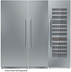 two stainless steel refrigerators side by side with the doors open and bottom freezer