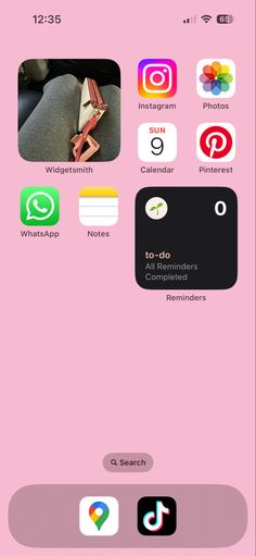 an iphone screen with several different icons on the phone and in front of it is a pink background