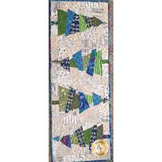 a quilted wall hanging with many different colors and designs on it's sides