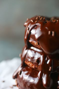 a close up of a chocolate doughnut with sprinkles